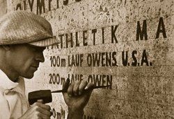 Carving the name of Jesse Owens into the champions plinth at the 1936 Summer Olympics in Berlin by American School