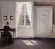 A Room in The Artist's Home in Strandgade, Copenhagen, with The Artist's Wife by Vilhelm Hammershoi